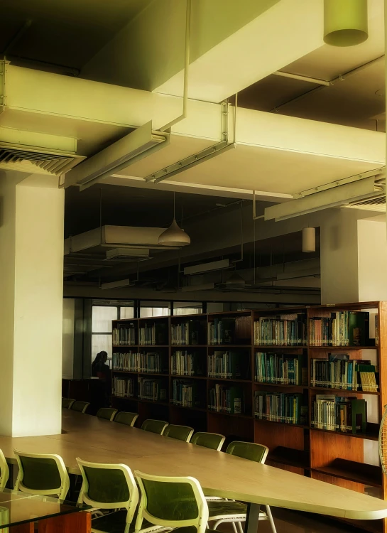 a desk and bookshelves in an empty liry