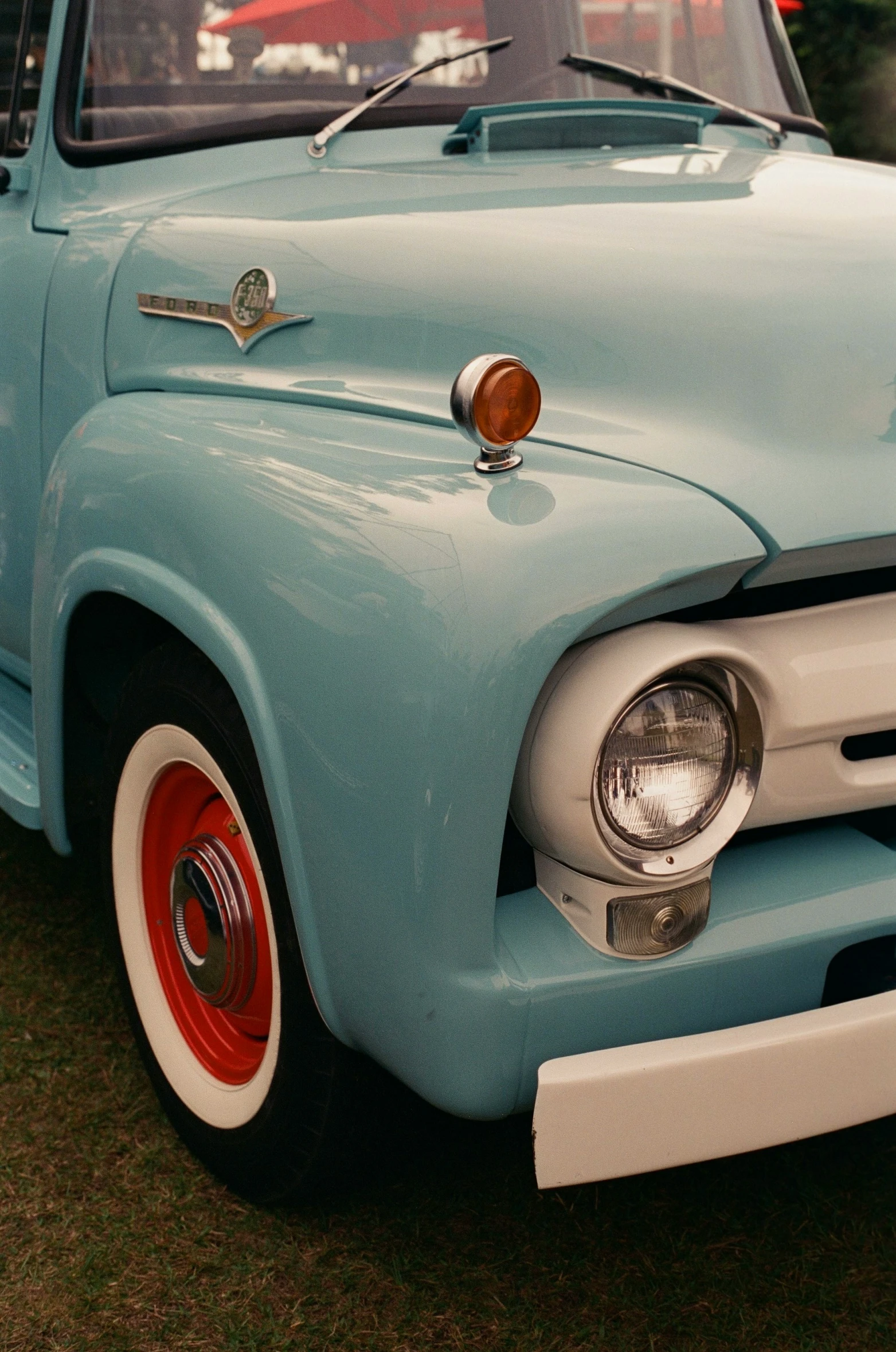 a large, light blue truck is shown