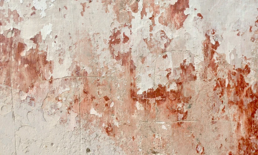 rusted wall with stains and some rust on it