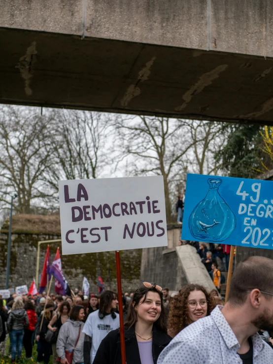 a group of people holding placares at a demonstration