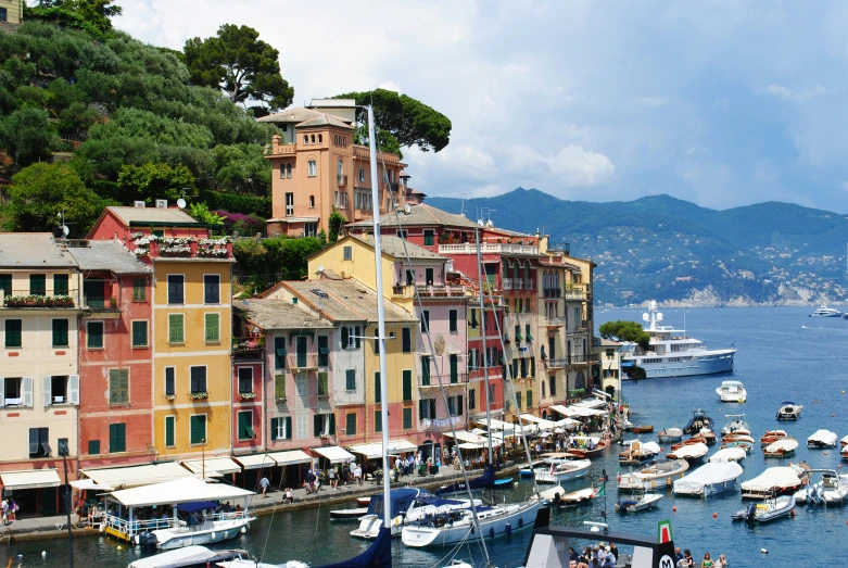 a harbor with small boats parked along side of buildings