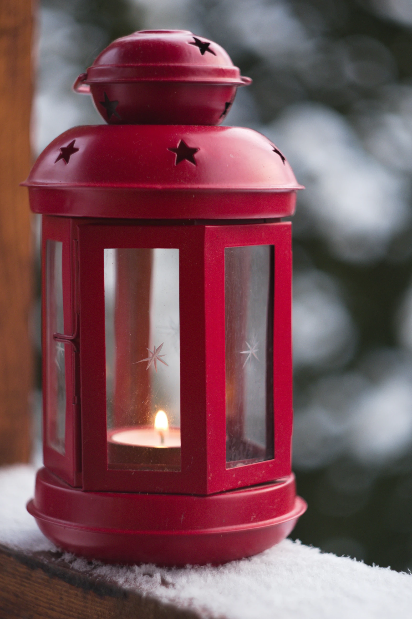 a bright red lantern is sitting on the porch