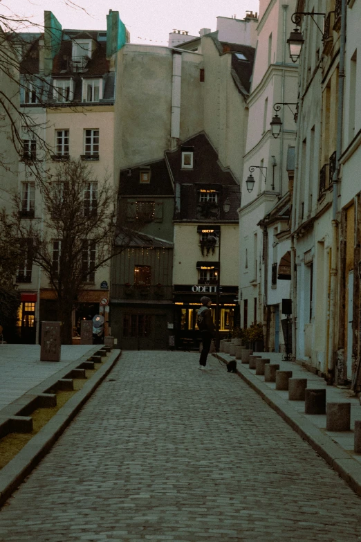 a person walking on an alley in a city