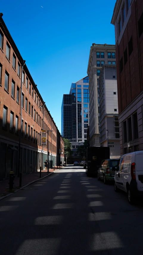 the empty street is lined with buildings in a row