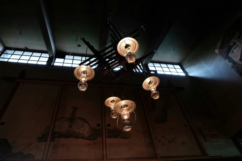 lamps inside the ceiling of an old looking building