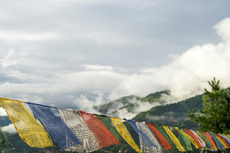 colorful flags are hung over an outside area