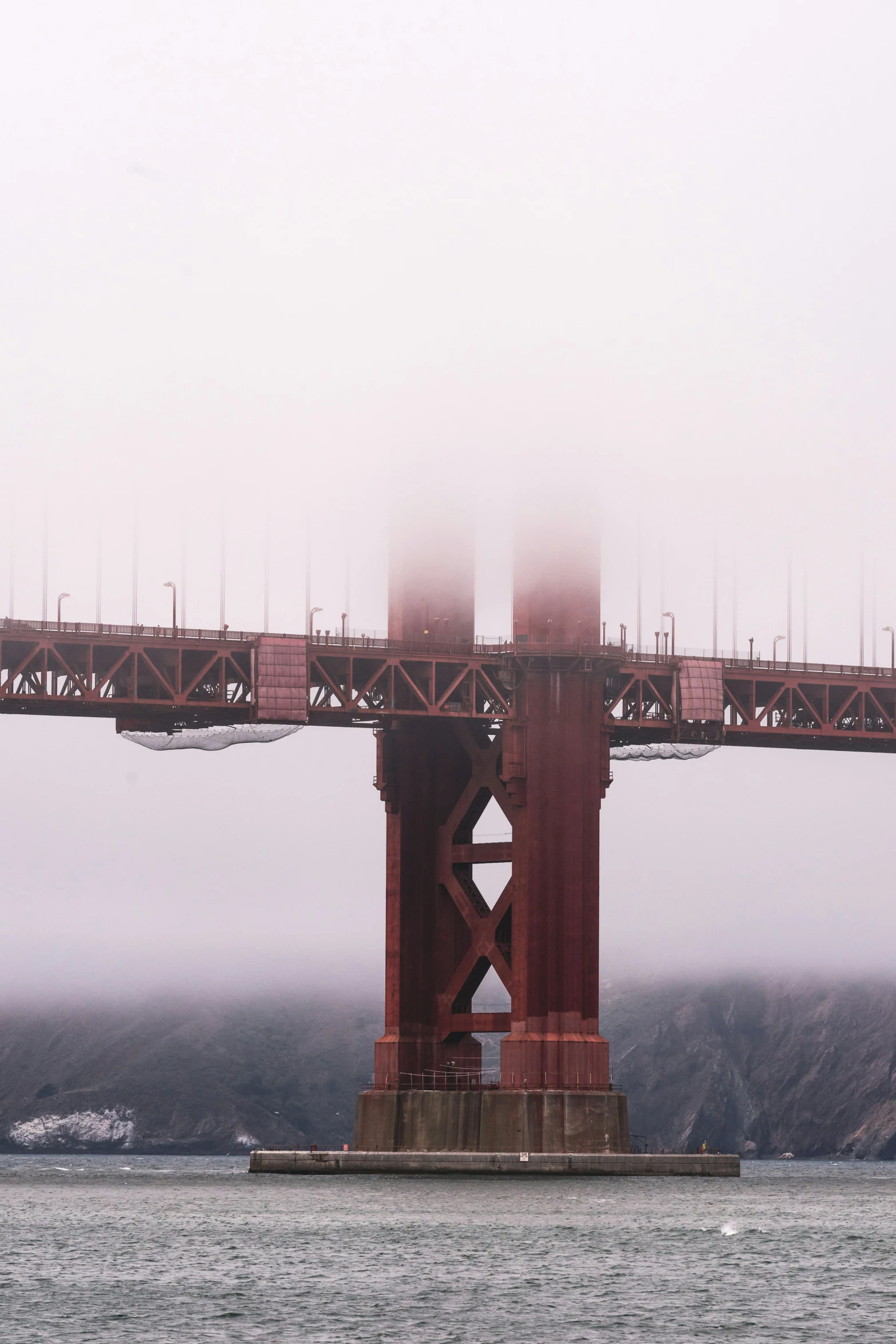 a bridge over water with buildings on it