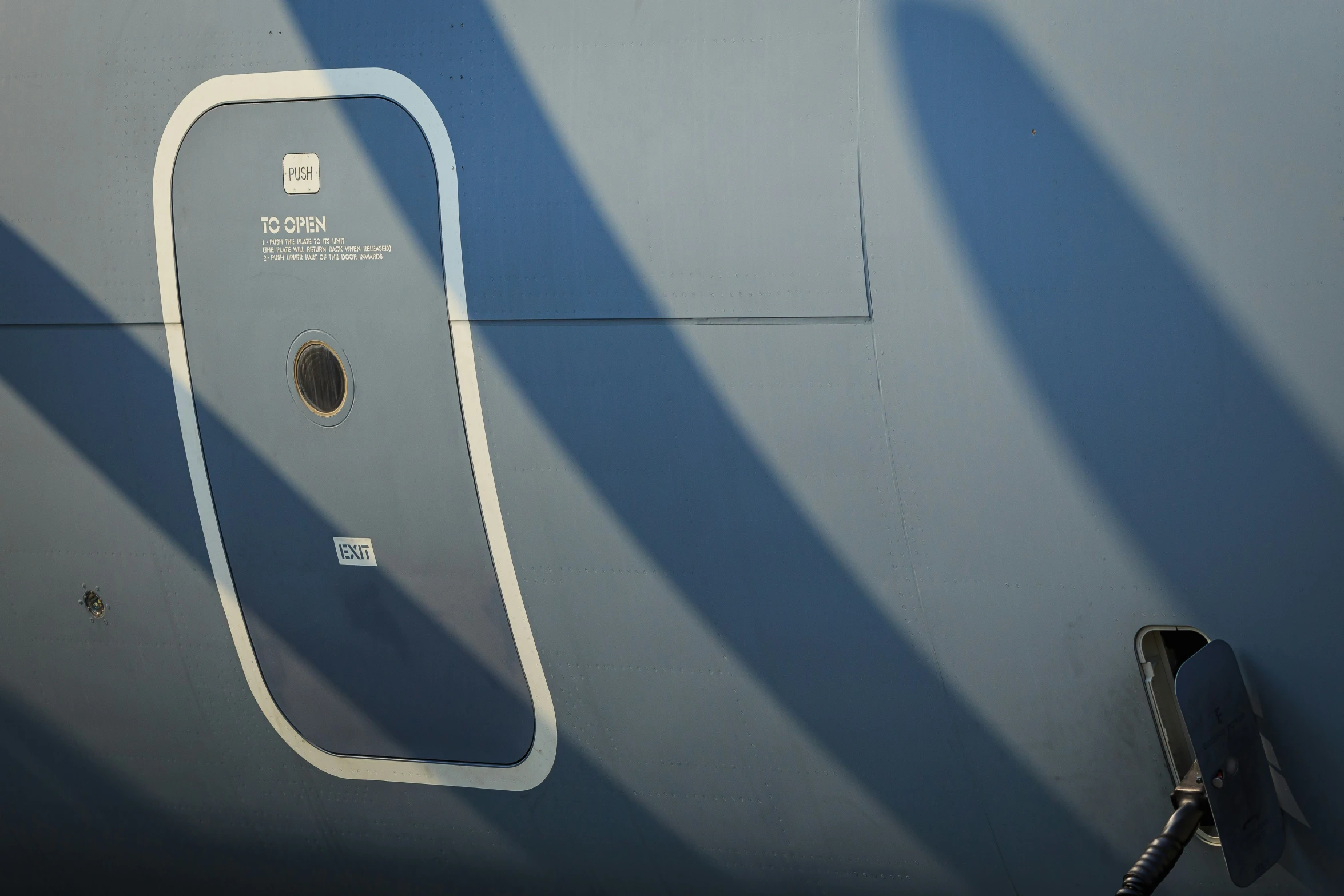 an airplane door with an iphone on on it