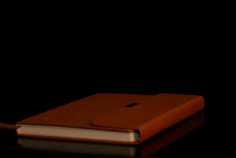 a closed book laying open on top of a table