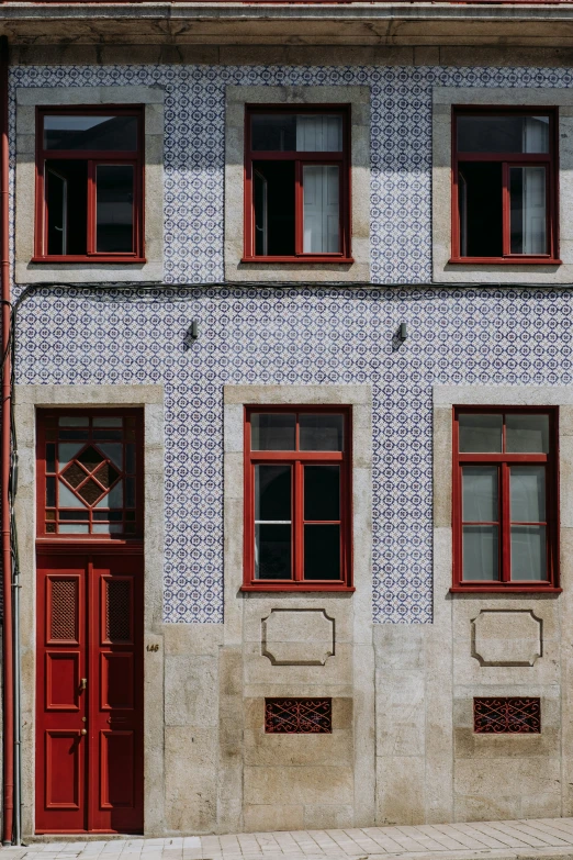 a double doored building on the side of a street