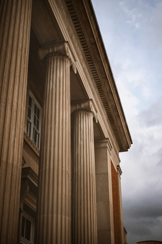 an old building with columns in the front