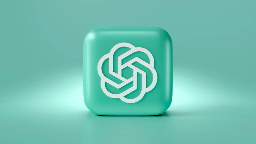 the green cube is shown with an intricate knot on it