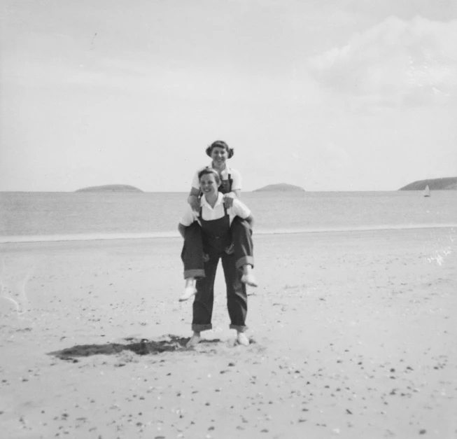 a man carrying a young child on his back