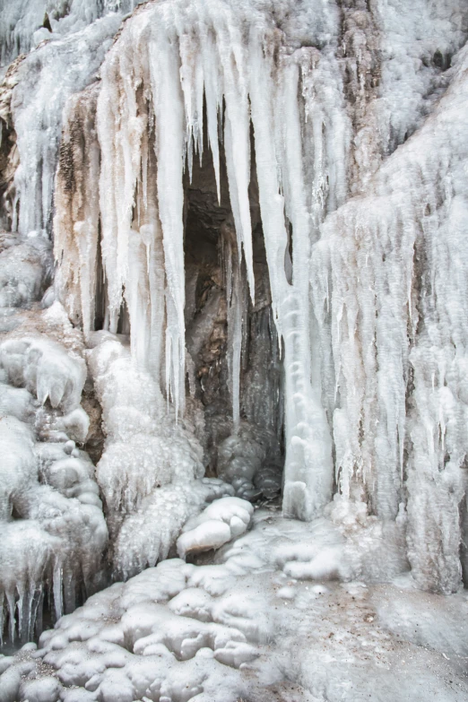 a cave with snow that is covered in ice