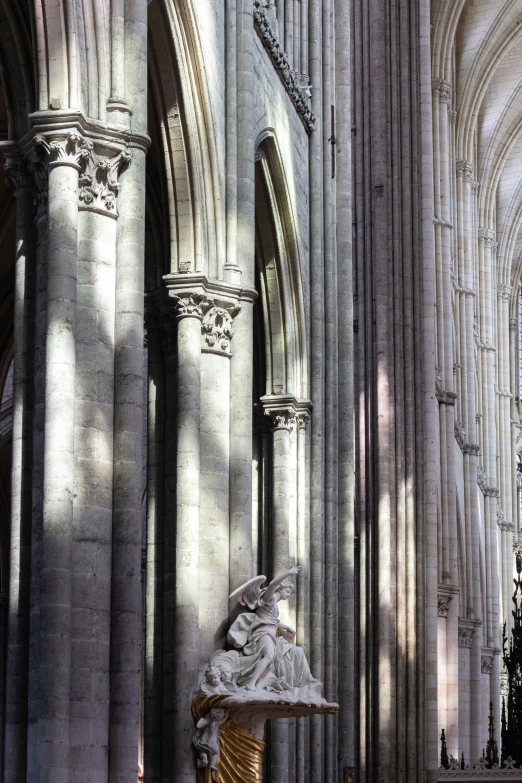 an old cathedral with a statue inside it