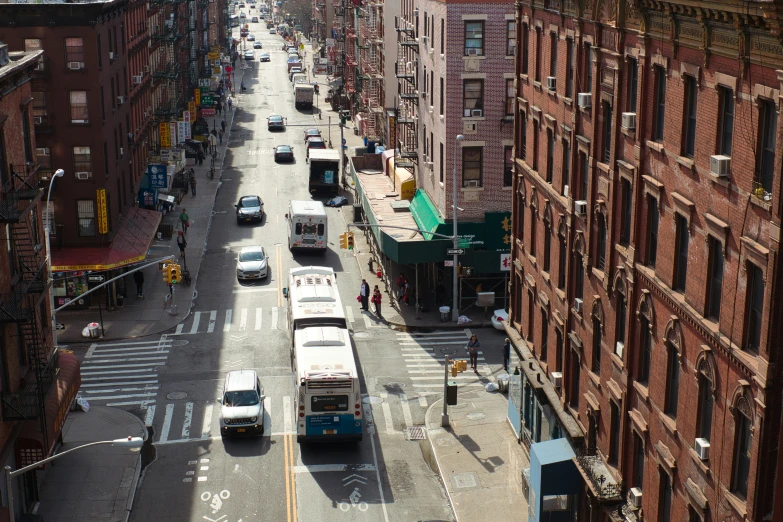 a city street scene with cars and buses on it