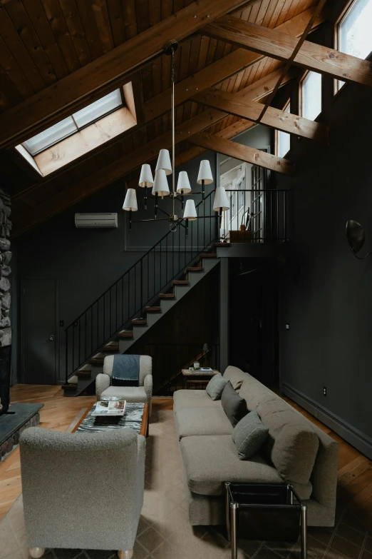 a large open plan living room with hardwood floors