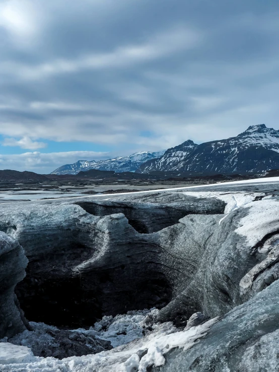 an image of an ice hole in the wilderness