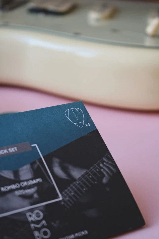 a brochure sitting on top of a pink table