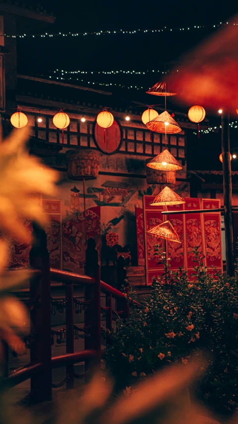 a restaurant with oriental style lighting and lanterns