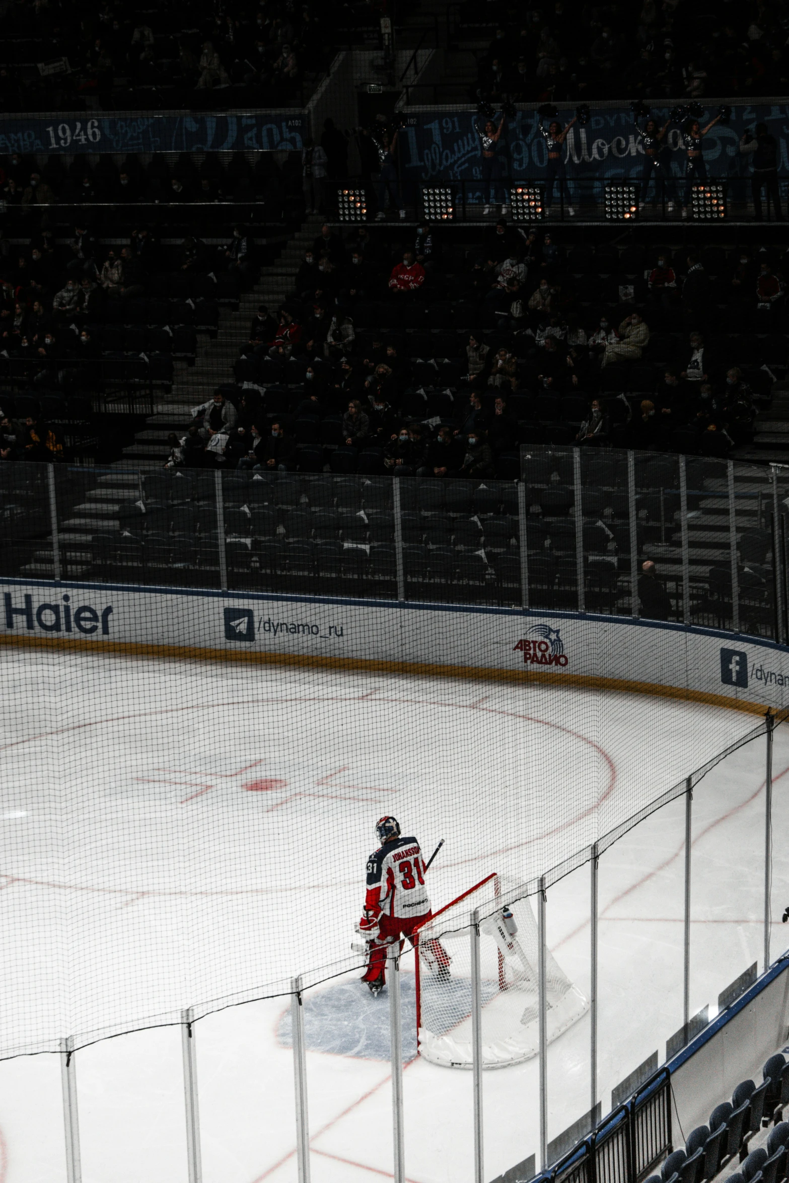 an ice hockey rink with a player on the goal