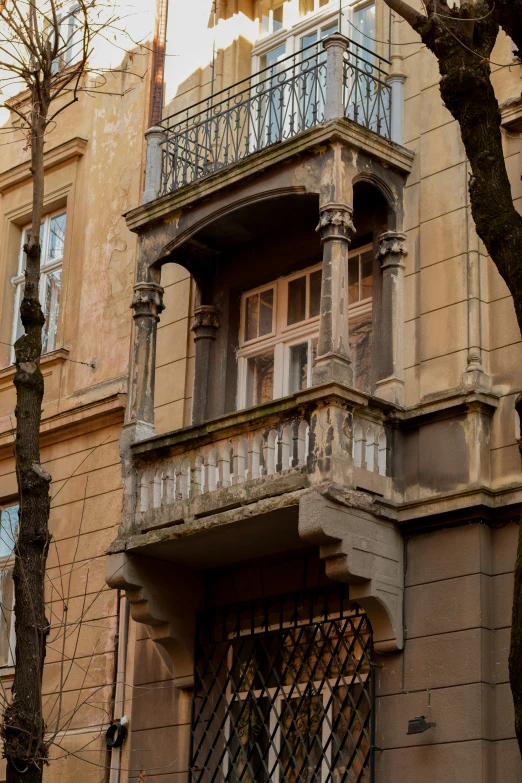 an old house in the city has balconys and windows