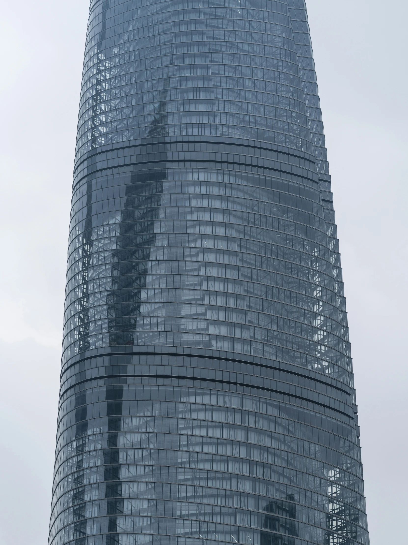 a reflection of a person in the side of a building