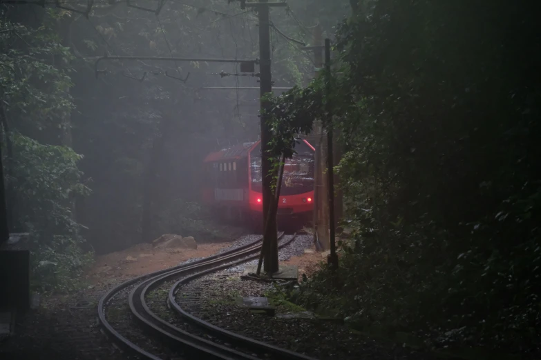 a train engine is pulling carts down a track