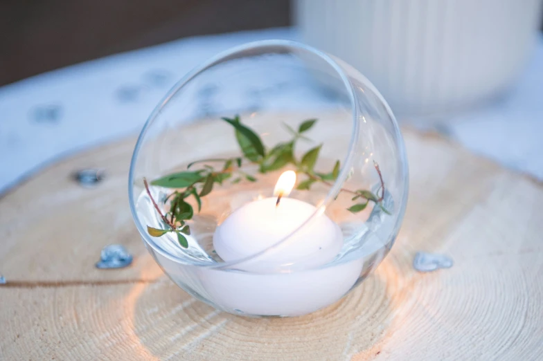 some type of candle sitting in a glass