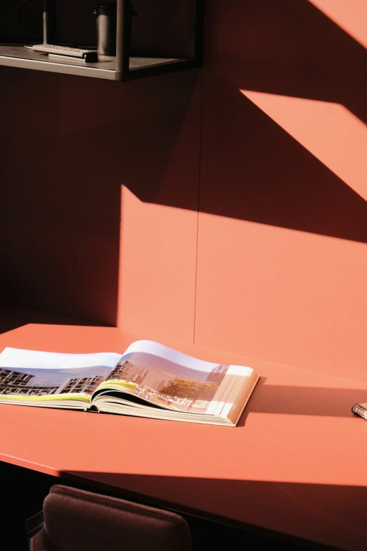 the shadow of a newspaper laying on a table