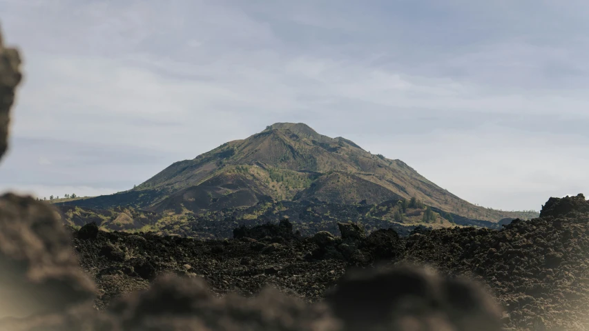 a beautiful picture taken from behind a very tall mountain