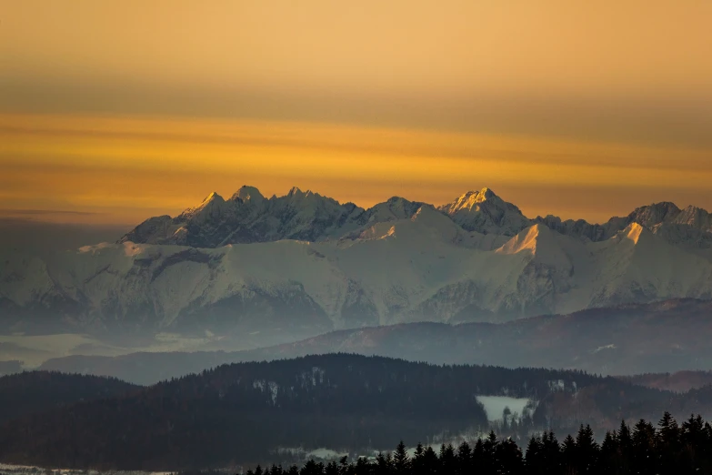 the view of snow - covered mountains and valleys, from above