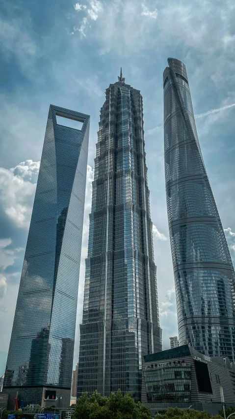 two very tall buildings standing next to each other