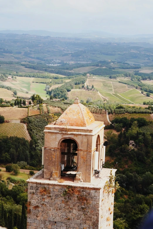 a bell tower overlooks an extensive landscape