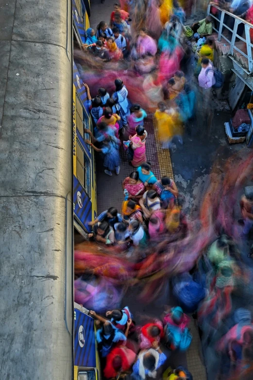 the color is blurry of people wearing colorful outfits