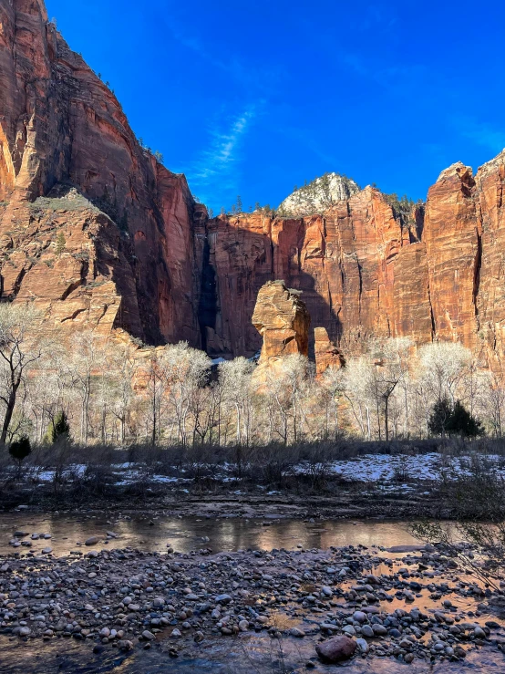 a landscape view of mountains and a river