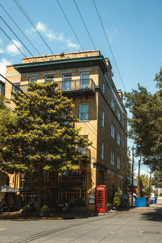 a building that is next to the street with power lines above