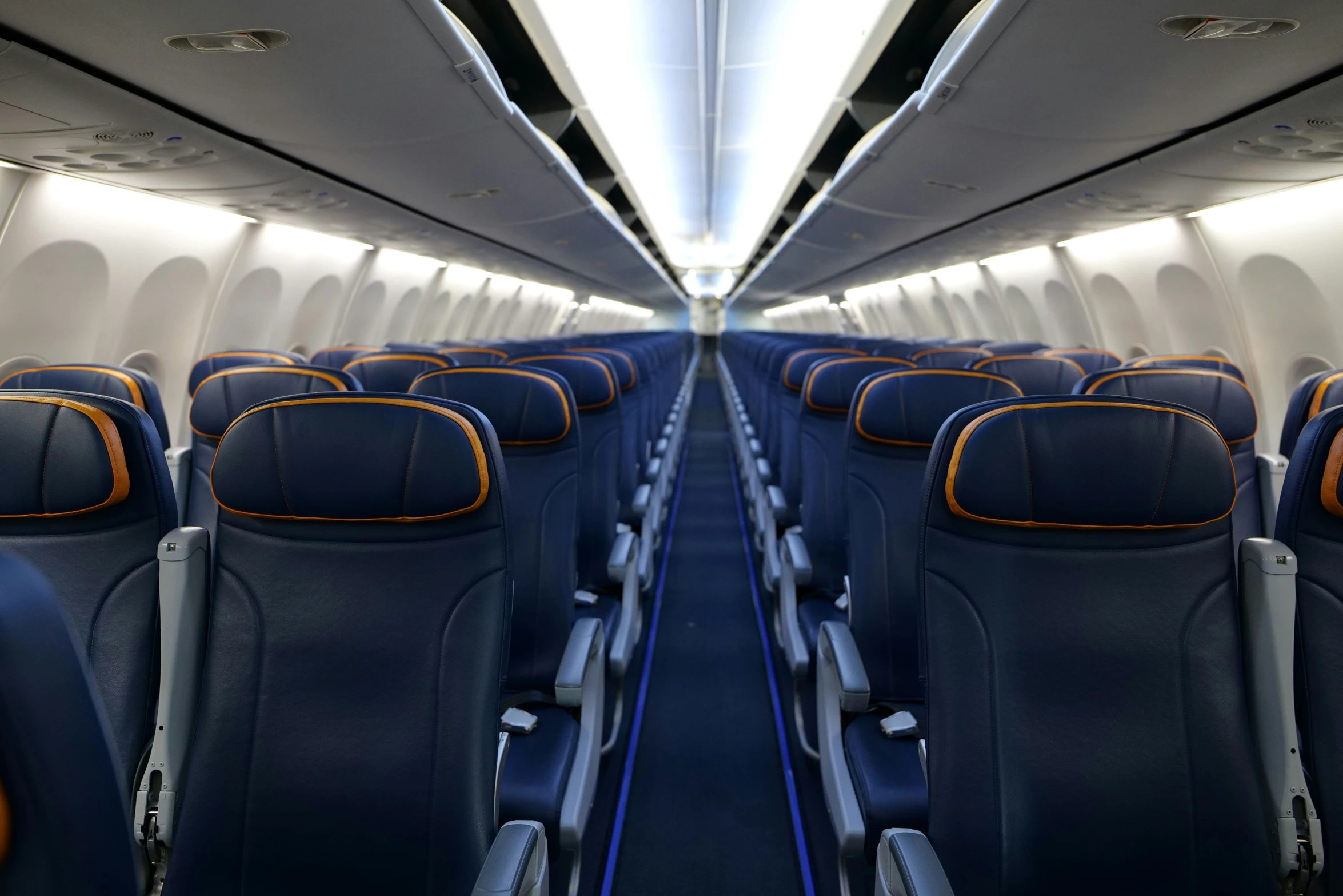 an airplane with empty seats sits parked on the plane