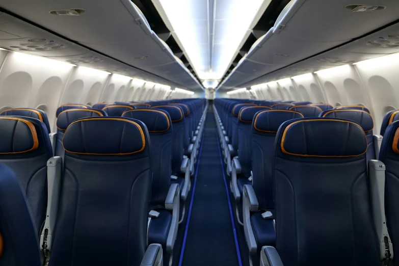 an airplane with empty seats sits parked on the plane