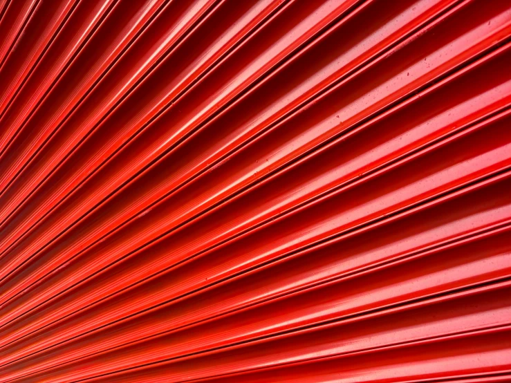 a red background with ridges that looks like wood or a grain