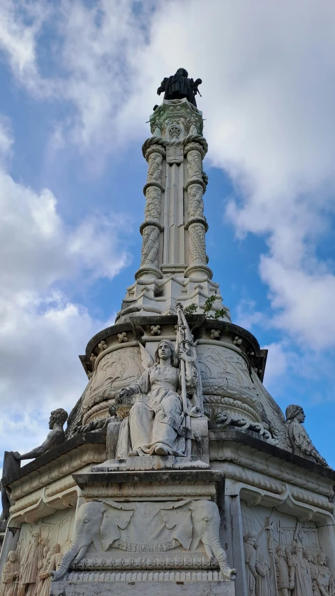 a statue on top of an architectural structure