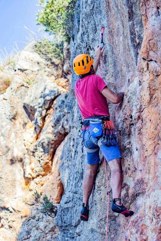 someone on a rock climbing in the wilderness