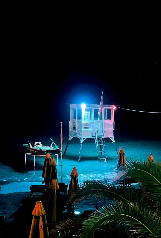 an empty beach area in the dark at night