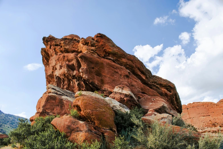 rocks are in the foreground against a bright blue sky