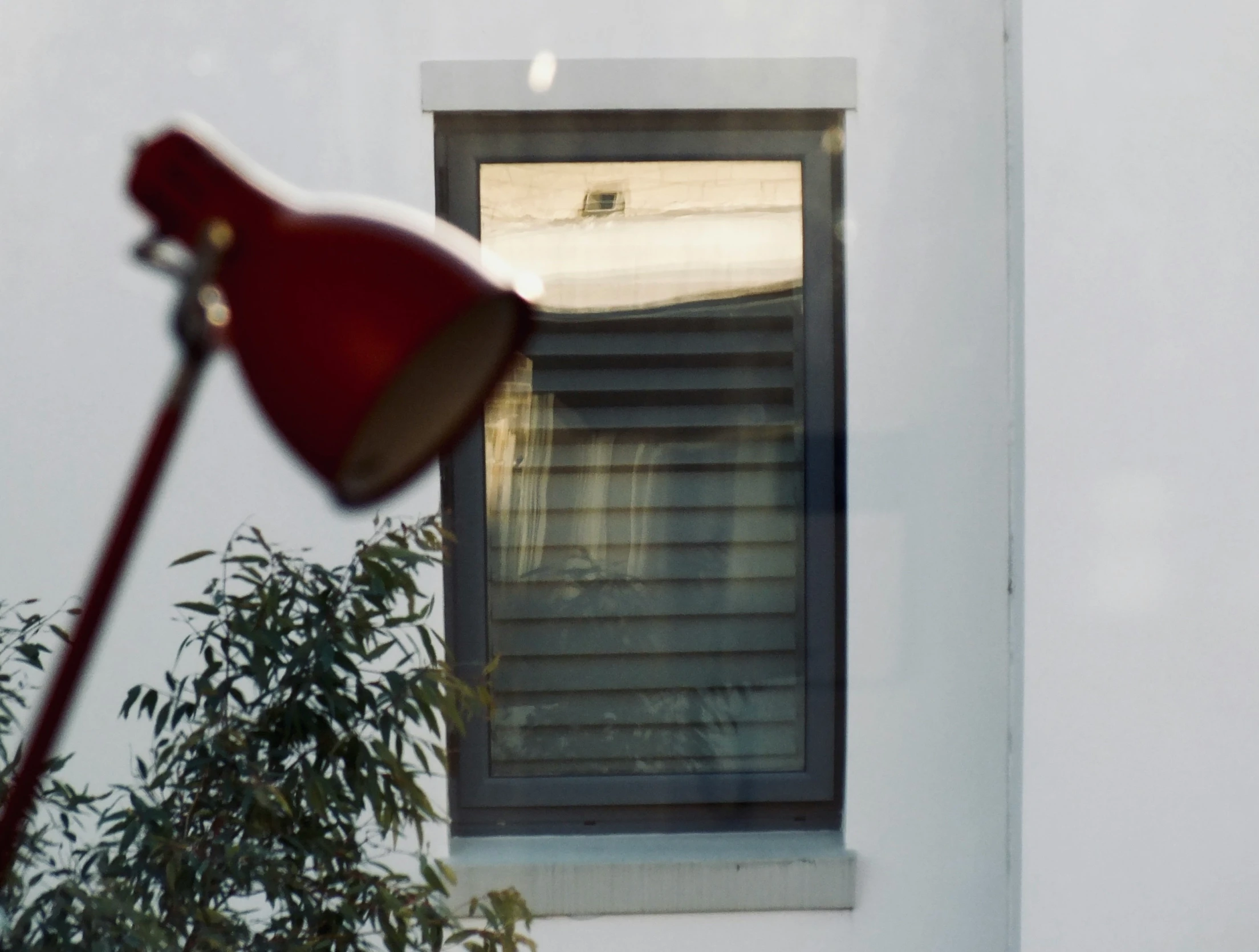 there is a red umbrella that has been left in the house