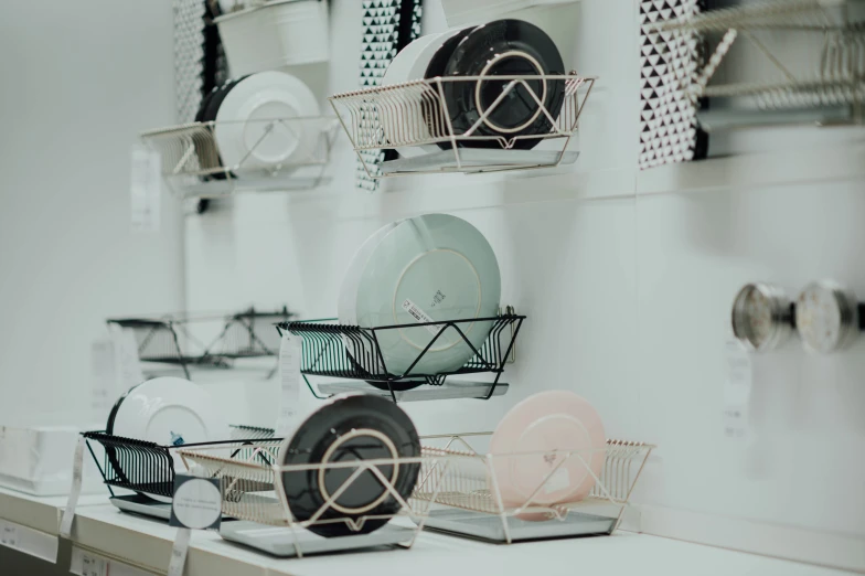 many stacks of white dishes and dishes in a store