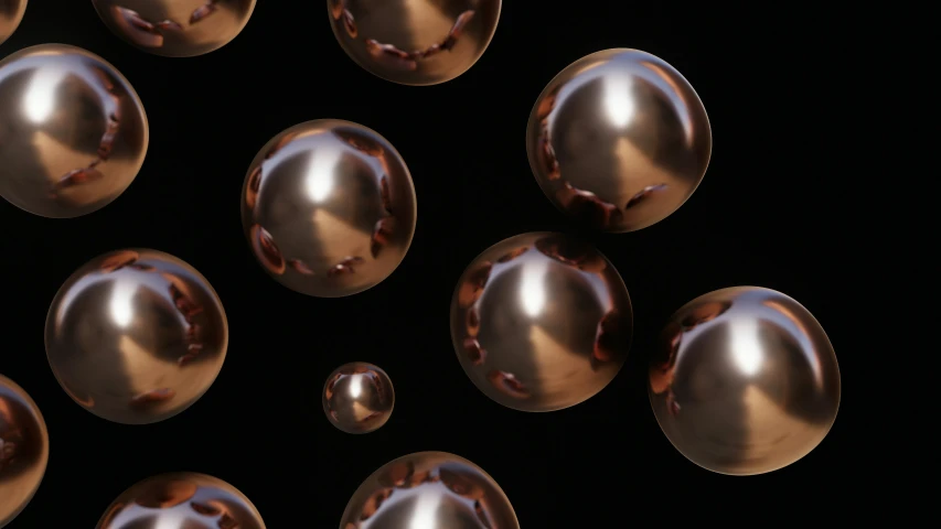 many metallic spheres on a black background