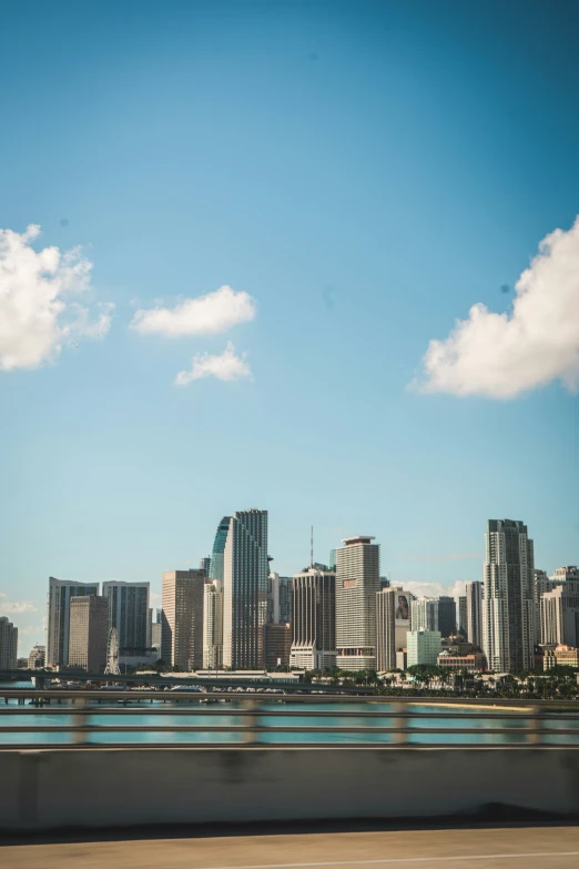 a city with many skyscrs towering over water