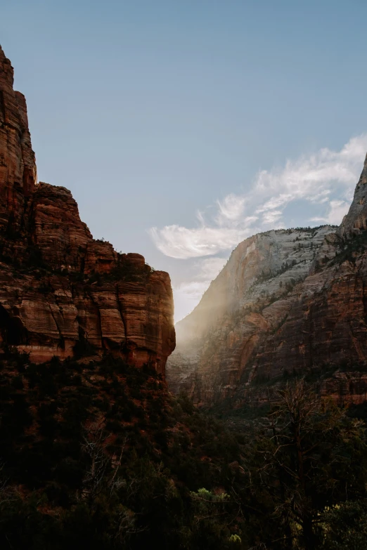 view of the sun shine on the canyon from the base of the mountain