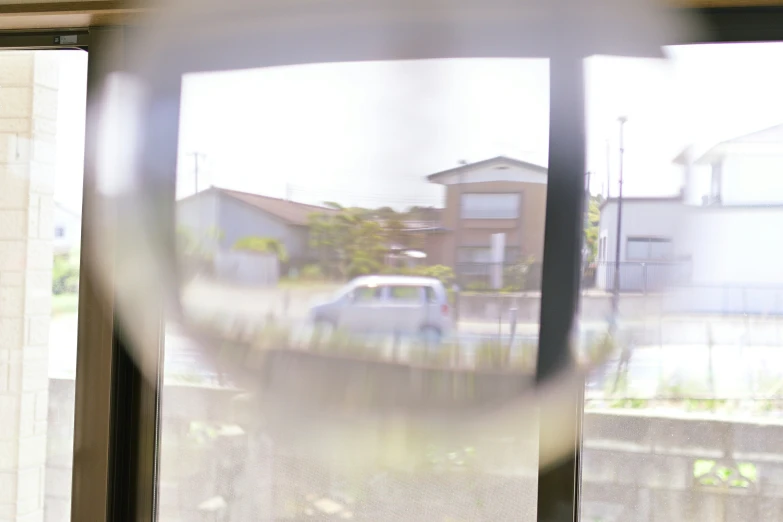 a view of a house through a car window